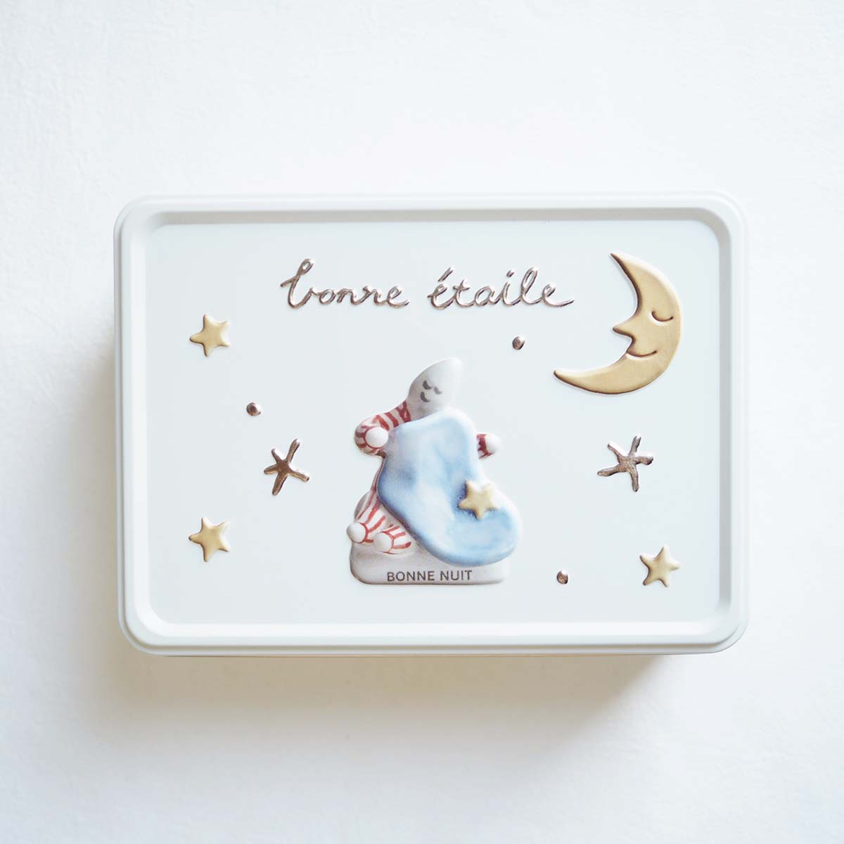 フェアリーケーキフェア×フェーブ作家Fèvesビスケット缶の表面